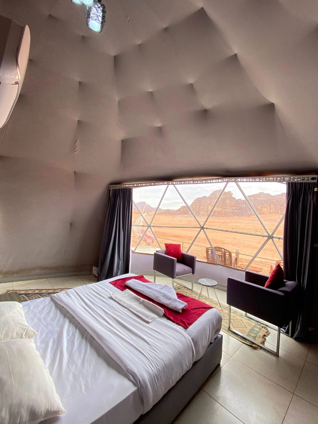 Inside a luxury tent, looking out over the desert