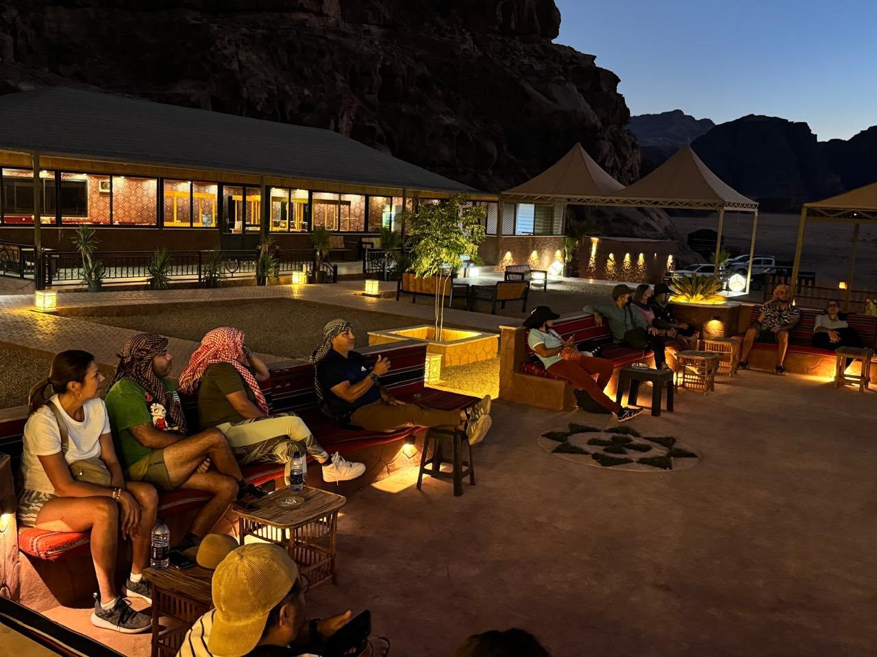 Travellers in the evening at a Wadi Rum camp