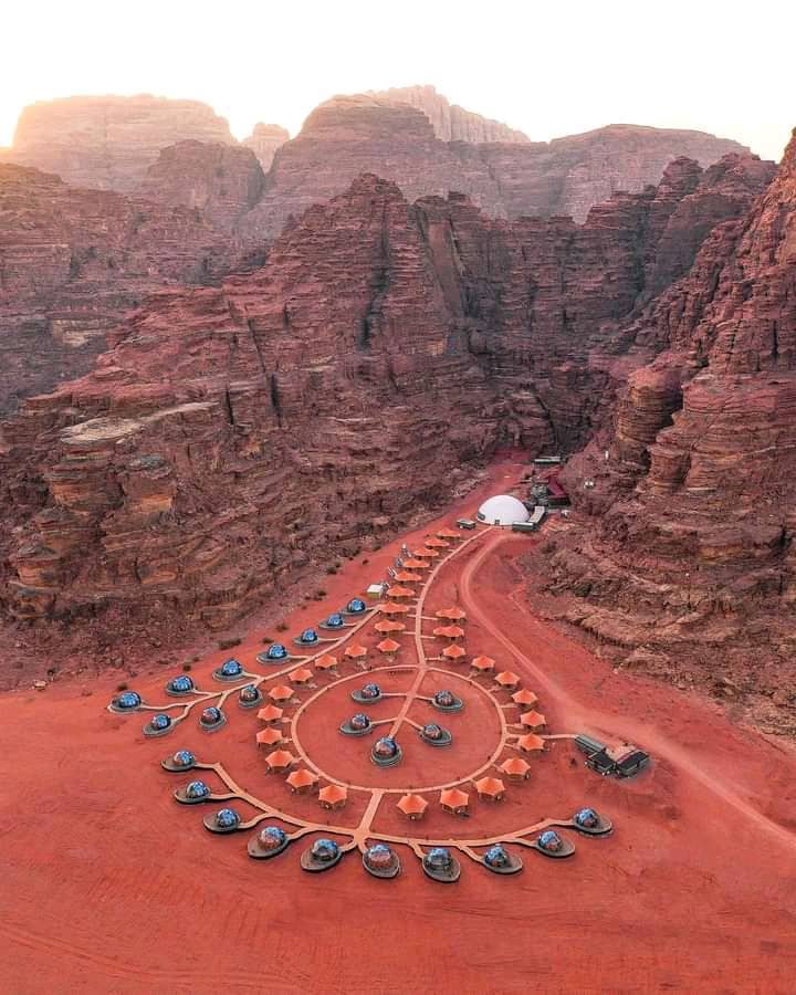 Tents pitched below the rock walls of Wadi Rum
